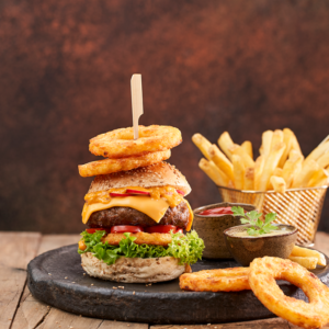 Any Burger + Any side (Onion Rings/ French Fries/Sweet Potato Fries) + Cane Of Soda